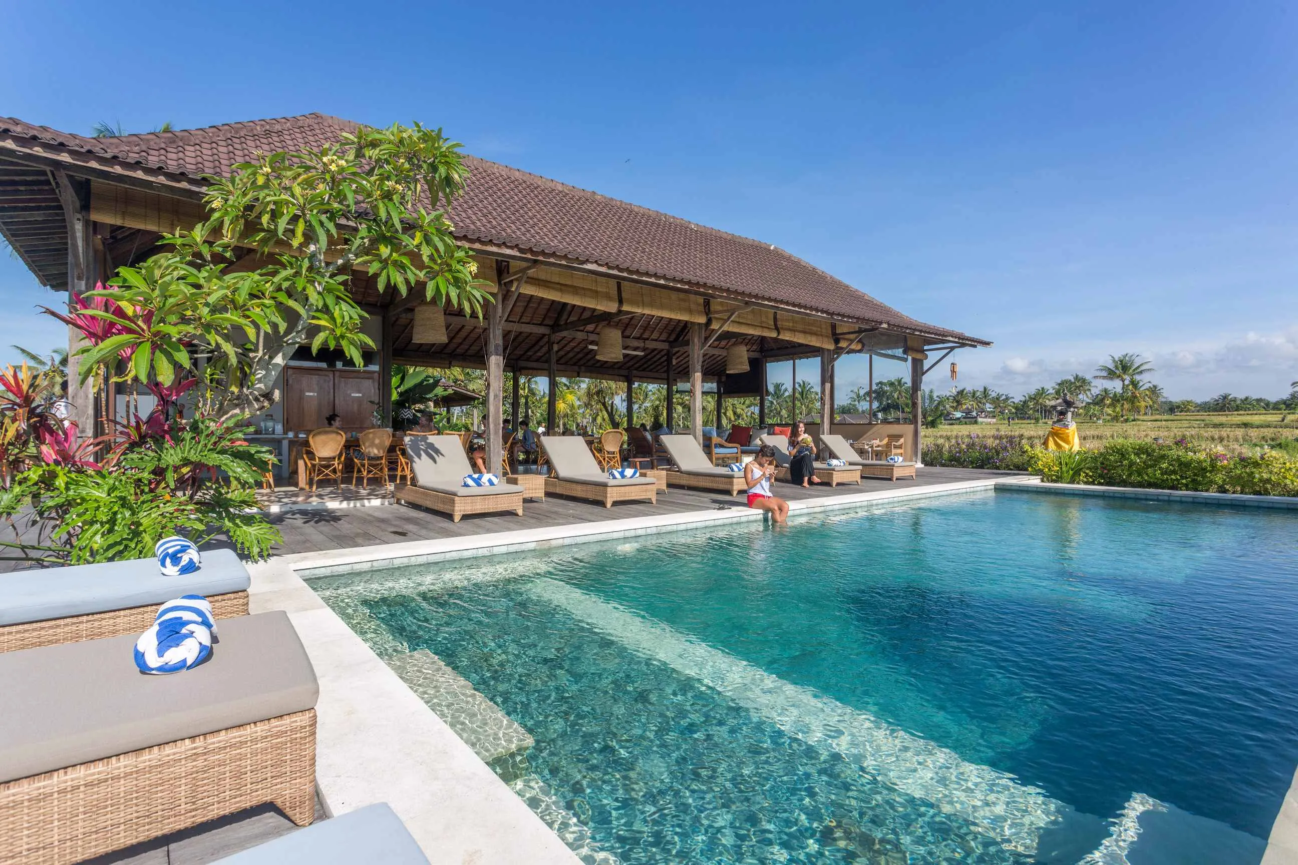 Reception lounge and dining area at Azadi Retreat Ubud Bali with rice field views